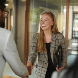 Woman shaking hands with her interviewer