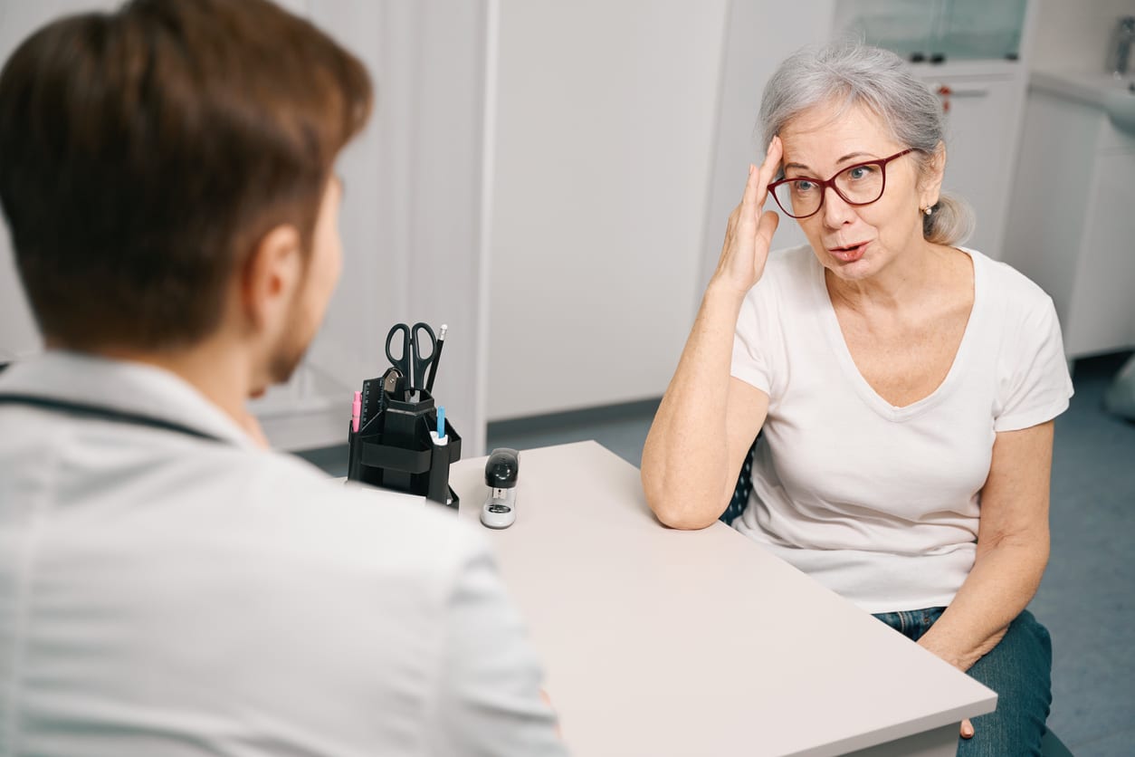 Patient explaining tinnitus to her provider.
