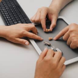 Patient looking at hearing aid options