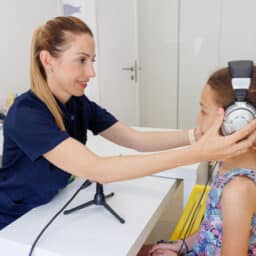 Young girl gets a hearing test