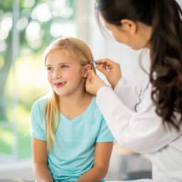 Fitting a Hearing Aid on a young girl