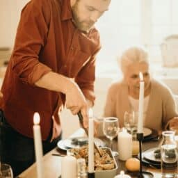 Happy family at the Thanksgiving dinner table