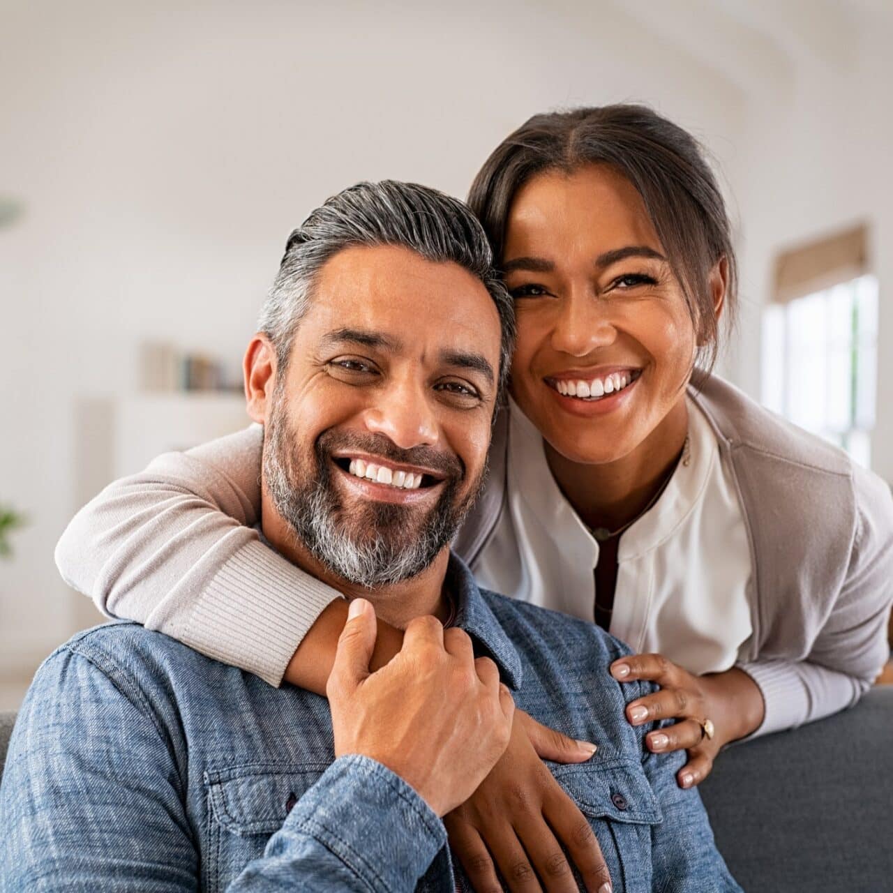 Happy father and daughter smiling together.