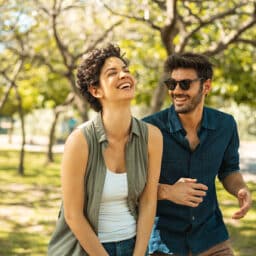 Two friends hanging out in a park on a warm, humid spring day