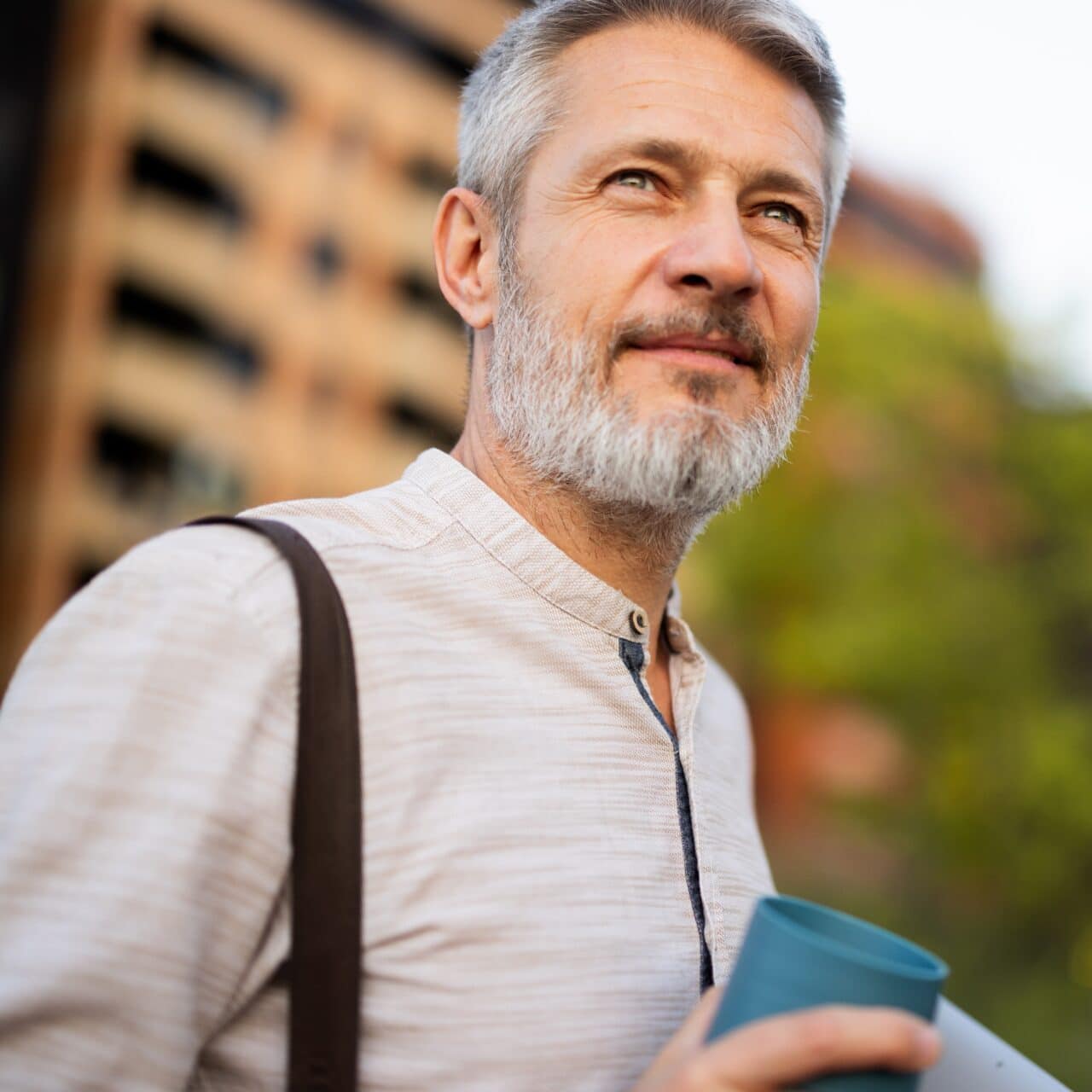 Smiling older man looks off into the distance